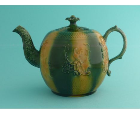 George III and Queen Charlotte: a Whieldon type teapot and cover with floral knop, moulded with crowned heads and an exotic b