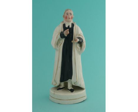 Rev John Wesley: a Staffordshire pottery figure depicted standing, circa 1840, index figure to right hand restored198mm.* See