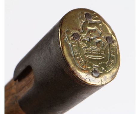 Unusual item of trench art in the form of a British 1908 pattern entenching tool handle with a badge, in brass, to the Kings 