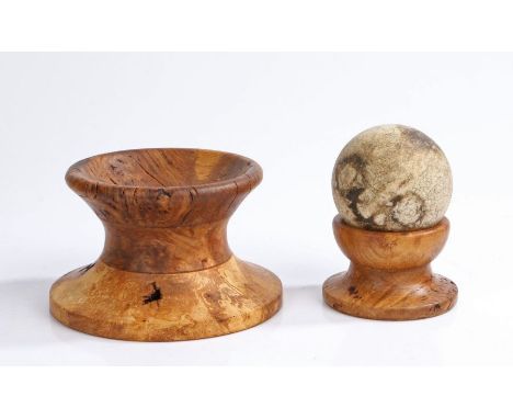 Turned wooden display plinths for cannon balls, the first is 9.5 cm in height, 12.5 cm in diameter, the second 5.5 cm in heig