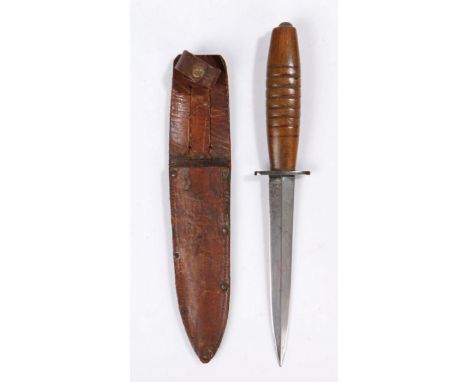 Second World War variant Fairbairn Sykes Fighting Knife, steel blade, broad oval shaped wooden handle, held in leather scabba