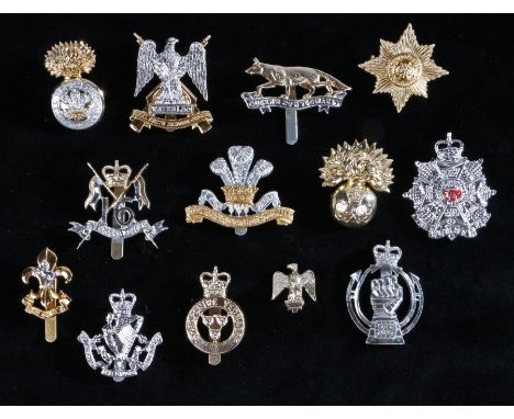 Selection of British army cap badges in anodised aluminium to include, The Border Regiment, slider marked 'Smith &amp; Wright