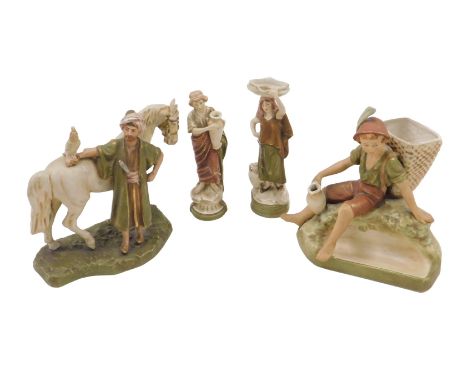A Royal Dux ceramic figure of an Arab man with horse and hawk, a figure of young man holding a vine hod, possibly for spills,