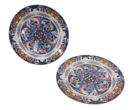 A pair of ceramic Delft style plaques, with multi-coloured printed decoration, unmarked, 42cm diameter. 