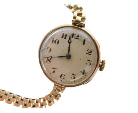 A Rolex lady's 9ct gold cased wristwatch, circular engine turned silver dial bearing Arabic numerals, fifteen jewel movement,