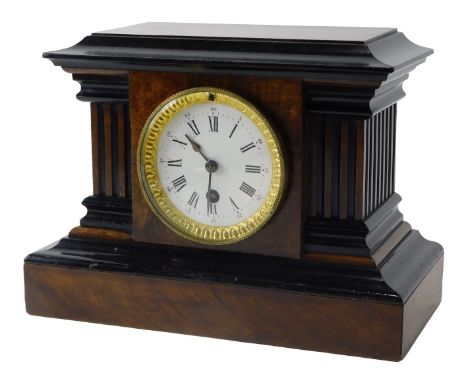 A late 19thC walnut and ebonised mantel clock, the enamel dial with Roman numerals, the case with reeded pillars on a plinth,