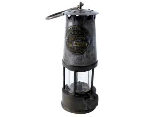 A Protector Lamp and Lighting Company type 6 miner's lamp, number 6, with ring handle, 23cm high. 