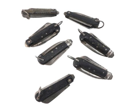 A collection of WWII and later British Army pocket/jack knives, with black Bakelite handles, undated. (7)