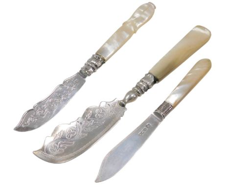 A Victorian mother of pearl and silver butter knife, Birmingham 1862, and two others. (3)