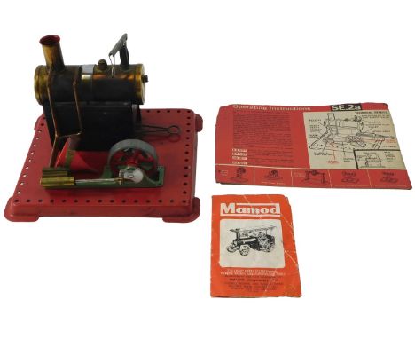 A Mamod tinplate static engine, with brass cylinder, adjustable lever, etc., 17cm long. 