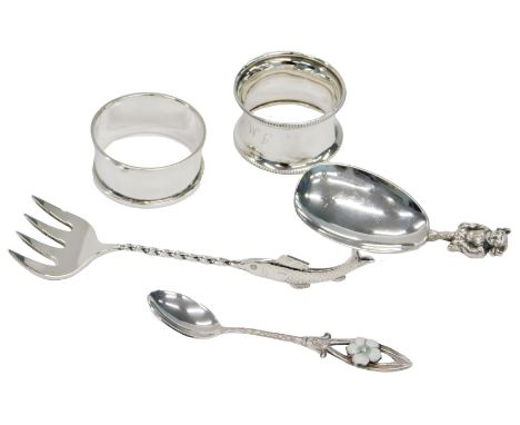 A quantity of silver, etc., to include a Lincoln imp handled caddy spoon, two silver napkin rings, a plated fish fork, and a 