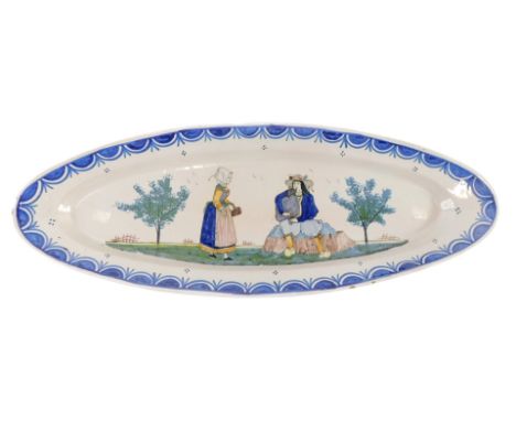 A 19thC large Quimper Faience oval platter, decorated with a lady with a basket and a gentleman playing pipes, HB stamp to un