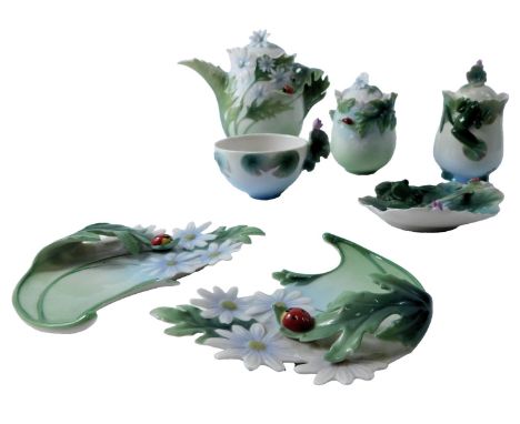A Franz porcelain part tea service, comprising teapot, 13cm high, teacup, saucer and spoon, two leaf shaped side plates, and 