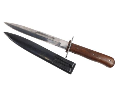 A replica German WWII fighting knife, with metal scabbard, blade unmarked, wooden handle.
