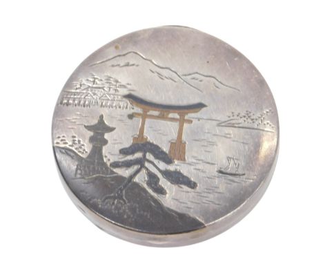 A Japanese Asahi silver compact, of circular form, Niello decorated with riverscapes, to the obverse and reverse, stamped ste