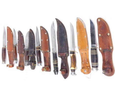 A collection of hunting knives, one with blade by Matao C.F., others with blades marked Sheffield England, etc. (7)