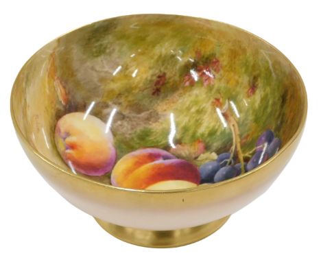 A Royal Worcester porcelain bowl, painted to the interior with peaches, grapes, etc., signed Ricketts, the outer in blush ivo