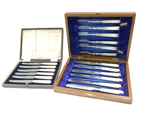 A set of six Edwardian silver plated and mother of pearl fish knives and forks, each with a silver ferrule, Sheffield 1909, i
