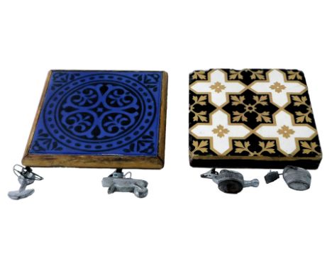 A Victorian Minton and Co tile, of encaustic design, in white, black and beige, 15.5cm x 15.5cm, and a further tile, in an oa