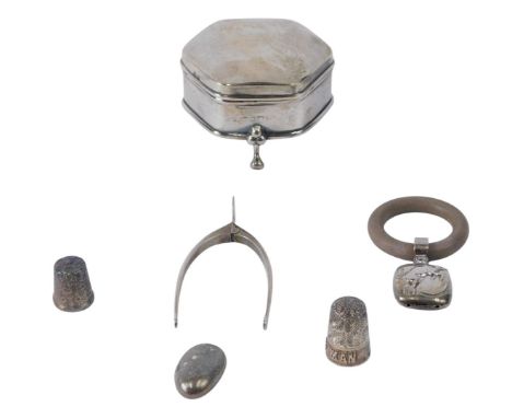 A collection of silver and silver mounted items, to include a trinket box, a bean, a rattle with composition teether, novelty