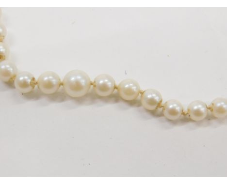 A pair of Crio cultured pearl earrings, in white metal screw fittings, stamped 9ct, together with a graduated cultured pearl 