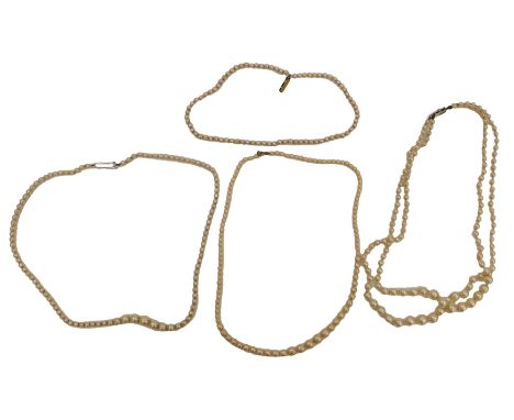 A double strand simulated pearl necklace, and three single strand simulated pearl necklaces. 