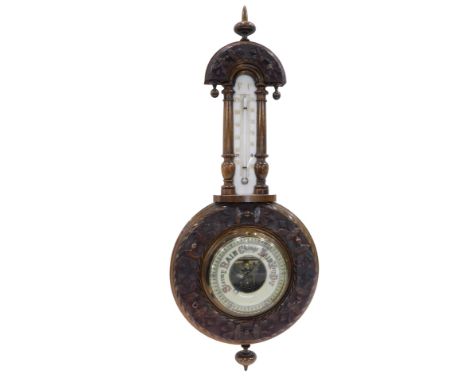 A late 19th/early 20thC walnut aneroid barometer and a thermometer, in banjo shaped case, 54cm high.