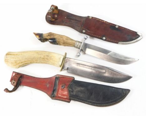 A pair of German hunting knives, one with antler handle, blade marked Whittle Solingen Germany, and one with deer's foot hand