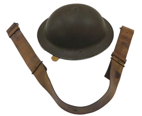 A British Army helmet, with liner and chin strap, helmet shell dated 1943, liners markings indistinct, size 7½, 194(?), toget