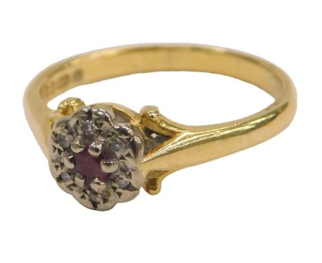 An 18ct gold ruby and diamond ring, in a circular setting, size N, 3.4g.