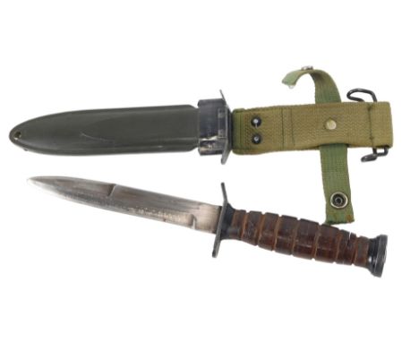 Post-war American M3 fighting knife, in a M8A1 scabbard.