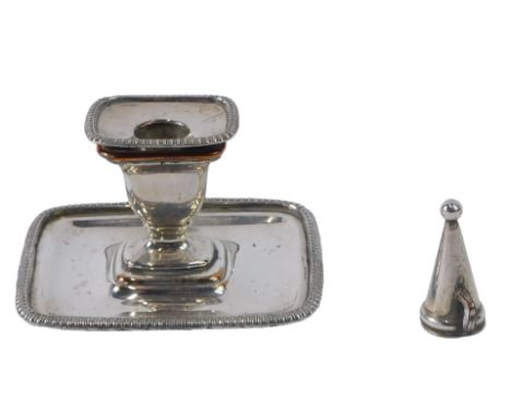 A small 19thC Sheffield plate chamber candlestick, with gadrooned border and a snuffer, 8cm wide. 