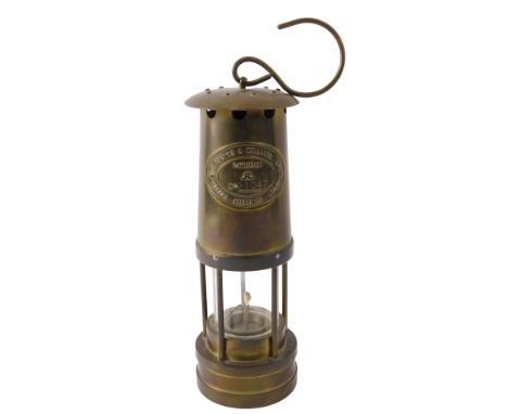 An E Thomas and Williams Limited of Aberdare brass miner's lamp, 25cm high.