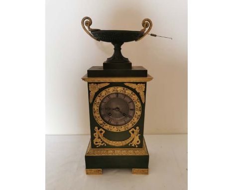 A French Napoleon III verdigris bronze and ormolu mantle clock with key and pendulum. Guyon A Lyon. 41cm high and 17cm wide. 