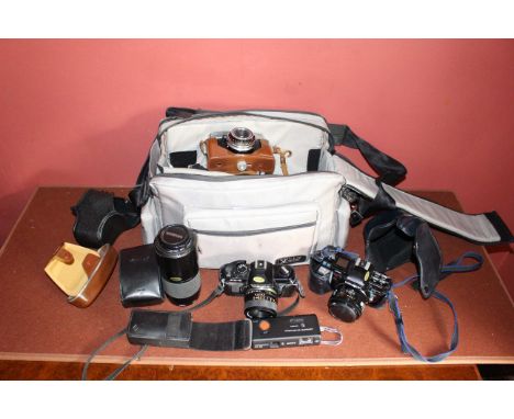 Vintage camera case cameras and accessories to include Minolta and Yashica.