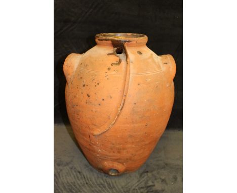 A terracotta jar and cover in the style of Compton pottery with twin handles, 44cm high condition:some chipping and damage  