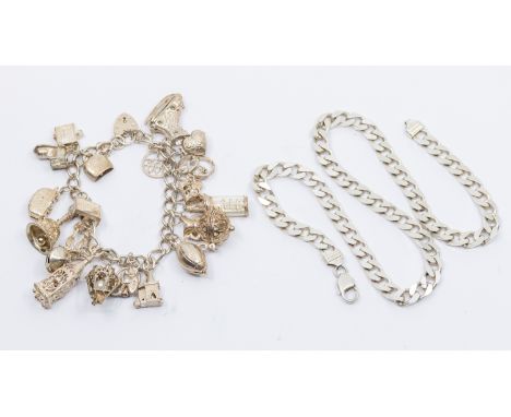 A Silver Charm Bracelet with Twenty-two Unmarked White Metal Charms and a Sterling Silver Curb Link Chain The Unmarked White 