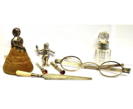 A COLLECTION OF SMALL SILVER INCLUDING AN EARLY 20TH CENTURY 'LADY' PIN CUSHION her hair in a bun, and wearing an empire line