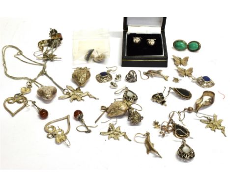 A COLLECTION OF SEVENTEEN PAIRS OF SILVER AND WHITE METAL EARRINGS, SOME GEM SET; in many varied designs including; flower; b