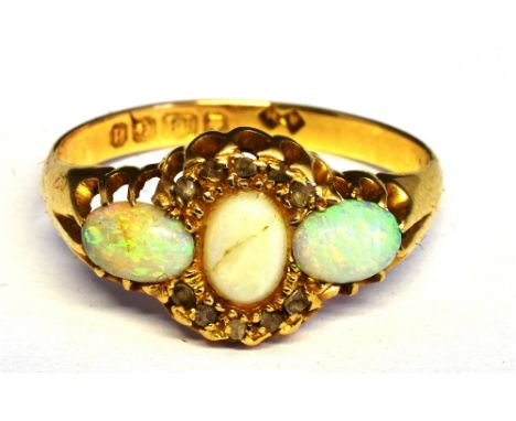 AN EDWARDIAN 18CT GOLD, OPAL AND DIAMOND RING centred with an oval cabochon white opal (cracked), within a partial tiny rose 