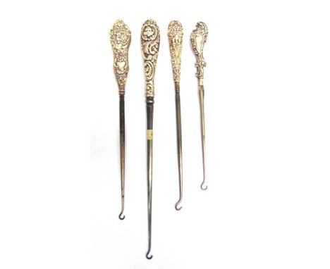 FOUR SILVER MOUNTED STEEL BUTTON/BOOT HOOKS INCLUDING A LATE VICTORIAN EXAMPLE OF A WHINSOME FEMALE SITTING ON A WALL  castin