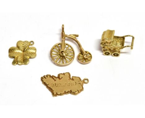 FOUR 9CT GOLD CHARMS OR PENDANTS INCLUDING A PENNY FARTHING AND A PRAM comprising; a penny farthing with rotating wheels, Lon