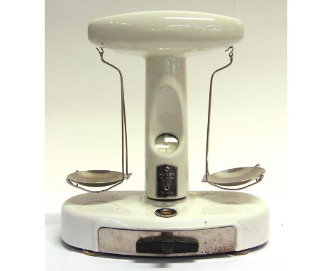 A SET OF AVERY SCALES  to weigh 50g. or 2oz., with weights in drawer to base, 24cm high. 