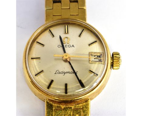 OMEGA, LADYMATIC, A LADY'S SWISS 18CT GOLD ROUND BRACELET WATCH circa 1963, brushed silvered dial with raised baton numerals 