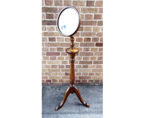 AN ADJUSTABLE SHAVING MIRROR  on tripod base, 146cm high (max), the mirror 28cm diameter