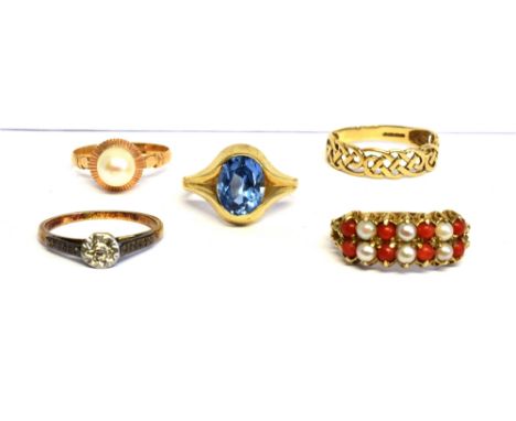 A COLLECTION OF FOUR GOLD AND GEM-SET RINGS AND A BAND RING  comprising; a tiny diamond single stone illusion ring, stamped '