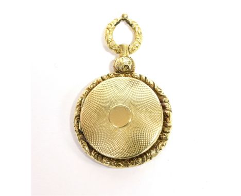 AN EARLY 19TH CENTURY GOLD VINAIGRETTE  of pocket watch form with central engine turned panels within floral chased borders, 