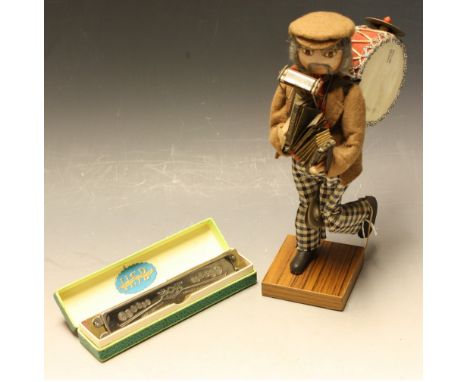 A Hohner advertising figure; a Hohner harmonica, Song Band Model 1 (2)