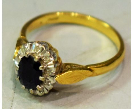 An 18ct gold diamond and sapphire ring