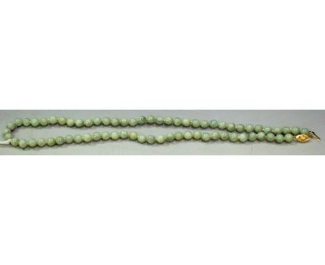 A jade bead necklace, 14k gold clasp